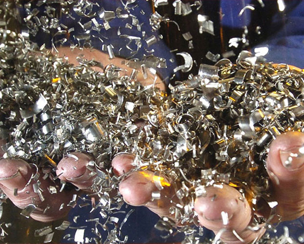 Processed titanium alloy ingot recovered from revert material